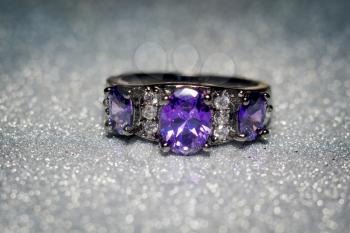 Fashion silver ring with purple zirconia, amethyst imitation.