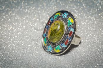 Decorative silver ring with unakite stone and enamel.