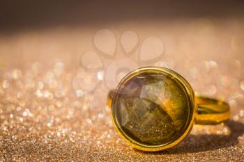 Fashion golden ring decorated with natural grey labradorite stone.
