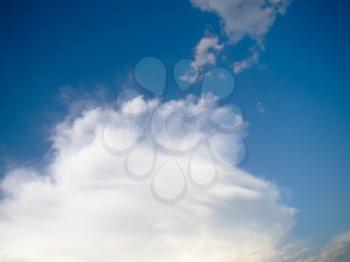 Blue summer sky with white clouds, natural background.