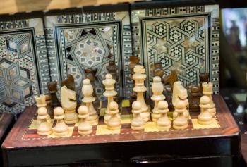 Intellectual game -chess. Wooden chess pieces on the chessboard