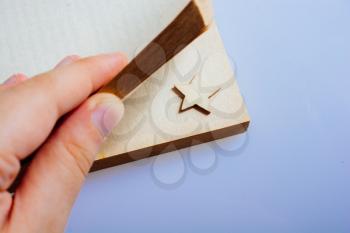 Hand holding a book with a star in its pages