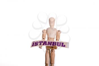 Wooden man holding Istanbul sign on a white background