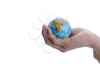 Child holding a small globe in hand on white background