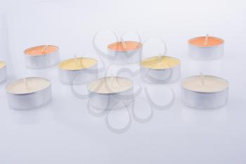 Colorful small Candles on a white background