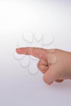 Little hand pointing at a model house on a  white color background