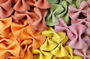Italian farfalle pasta flavors. Creative food background.