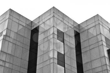 Modern building marble and glass facade abstract background. Black and white.