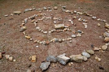 Spiral made of stones abstract geometric shape. Nature background.