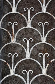 Vintage rusty pattern floral motif abstract iron door frame background.