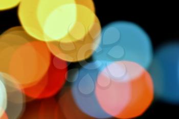 Abstract blurry lights at night colorful circles background.
