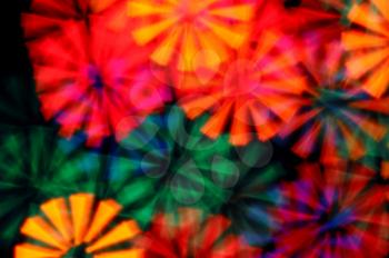 Colorful light rays abstract blurry circles psychedelic background.