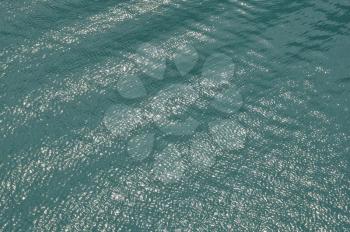 Light reflections on sea water on sunny summer day.