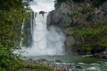 A view of majestic Snoqualmie Falls from below.