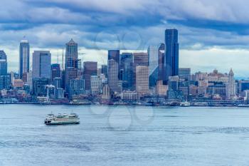 A view of the Seattle skyline with dark clouds overhead.