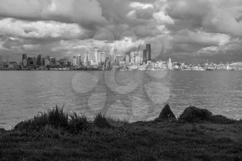 A view of the Seattle skyline across Elliott Bay. Black And white image.