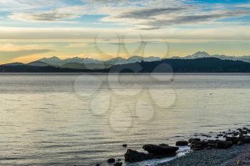 A view of the Olympic Mountains across the Puget Sound at sunset.