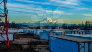 A veiw of shipping containers and Mount Rainier.