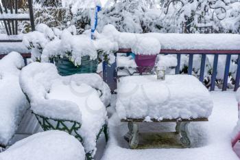 A ruler peaks up from a pile of snow on a front porch in Burien, Washington.