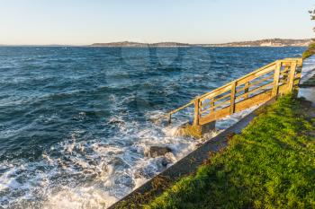 A staircase leads to the sea in West Seattle, Washington.