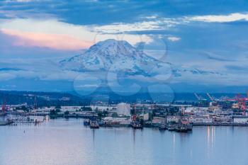 A view of Mount Rainier and the Port of Tacoma at twilight.
