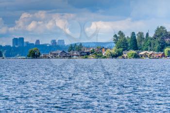 A view of lakeside homes in Renton, Washington with Bellevue in the distance.