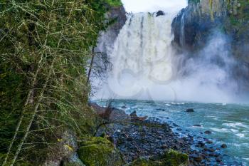 Water explodes at the bottom of Snoqualmie Falls in Washington State.