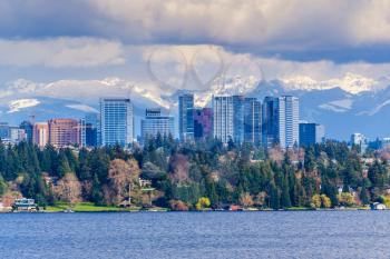 Modern buildings in Bellevue, Washington with the Cascades Range in the background.