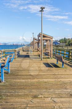 A view of a wooden pier in Ruston, Washington.