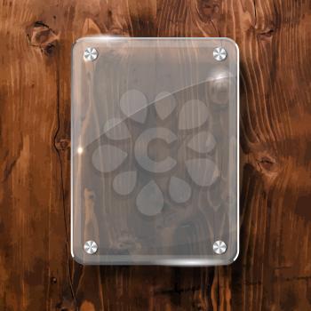 Glass plate on a wooden background for your advertising and design