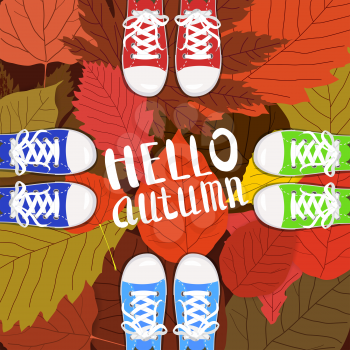 Hello autumn color illustration. Persons feet standing in sneakers on yellow, red, green fallen leaves. Hand drawn lettering.