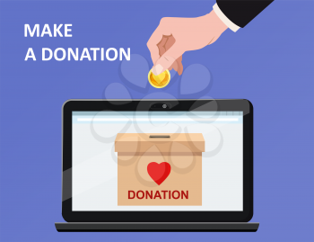 Donate online payments. Hand insert money gold coin in to the donation box on a laptop PC display