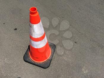 Traffic safety cone on road on hot day