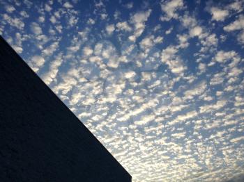 blue sky cirrocumulus astrocumulus clouds with modern building background