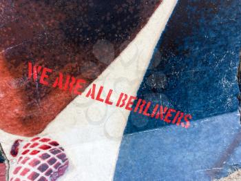 We are all Beliners JFK John F Kennedy quote in red text paint as urban art on berlin wall