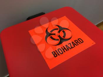 biohazard red label container for needles and syringes