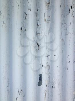 White rustic abstract design background chipped paint flaking corrogated metal sheet