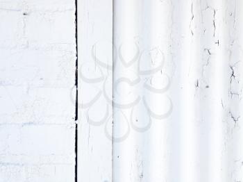 White rustic abstract design background chipped paint flaking corrogated metal sheet