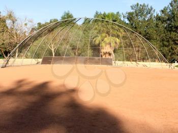 Baseball field backstop outdoor at park no people on sunny day