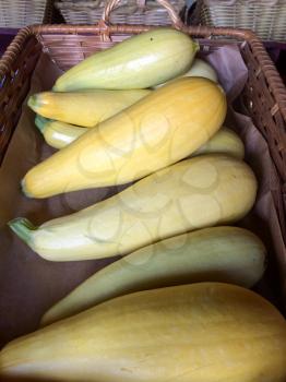 yellow squash in basket for sale farmers marketplace
