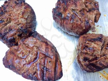 filet mignon grilled juicy cow beef on silver background plate