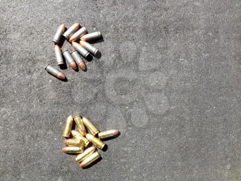 Bullets 9mm 40 caliber close up on table