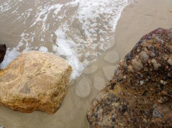 Natural background Beach surf coastline sand foam rocks stone