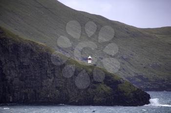 Lighthouse at the Drangarnir Hike near Sørvágur on the Faroe Islands in the Atlantic Ocean