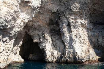 Crystal Lagoon caves view from ship, Comino, Malta