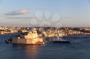 Valletta, Malta - 6 January 2020: Panoramic view of the three cities at sunset