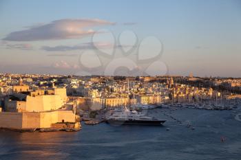 Valletta, Malta - 6 January 2020: Panoramic view of the three cities at sunset