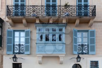 Valletta, Malta - 5 January 2020: Typical Maltese blinds and balconies