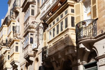 Senglea, Malta - 5 January 2020: Typical Maltese blinds and balconies