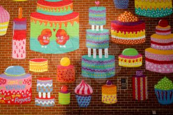 MONTREAL, CANADA - AUGUST 20 2014:  Cakes graffiti on a brick wall in Montreal.

